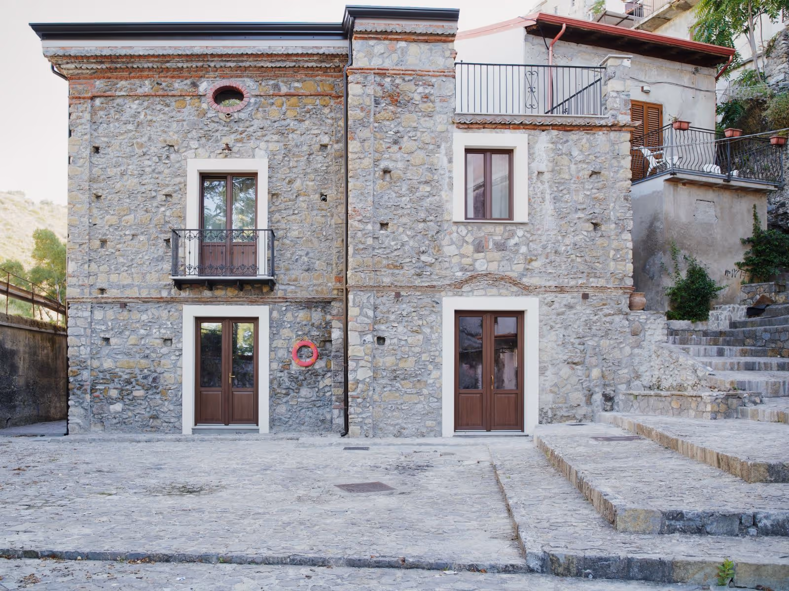 Stone facade of Casa Marinari, in the old town of Scalea.